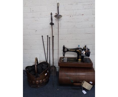 A COPPER COAL SCUTTLE with iron poker, tongs and shovel, an oak-cased Singer sewing machine, a three-edged sword with cast me