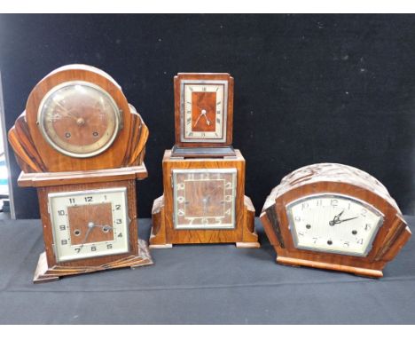 A HARROD'S ART DECO WALNUT CASED CLOCK (in need of attention), and four other Art deco style mantel clocks (5) (sold as seen)