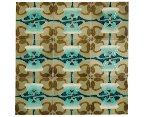 MINTON CHINA WORKS: AN ART NOUVEAU TILE PANEL possibly by Desvres, c.1900, the nine tile mounted panel decorated with a highl