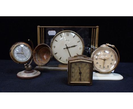 A U.S.S.R SLAVA SPUTNIK CLOCK together with a Bayard travelling clock, a Europa globe clock and a mantel clock (4)