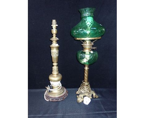 A VICTORIAN OIL LAMP WITH GREEN GLASS SHADE AND RESERVOIR (electrified) with a Chinese style brass table lamp with large silk