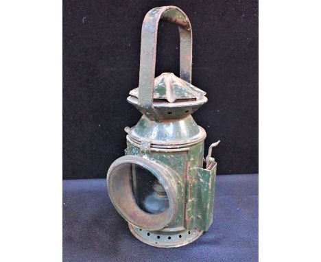 A RAILWAY (?) LAMP, BY WAKEFIELD'S BIRMINGHAM marked with broad arrow, painted Army green (with burner)