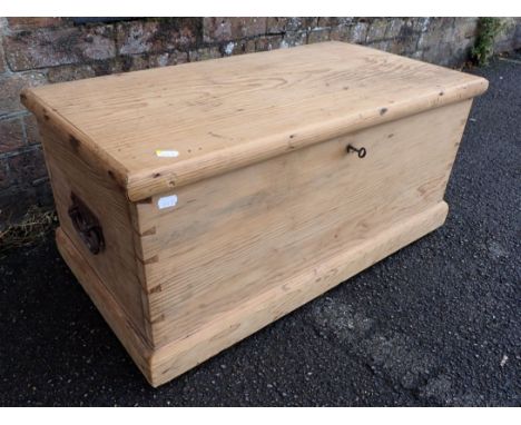 A SMALL 19TH CENTURY STRIPPED PINE TRUNK later fitted with lift-out trays 74cm wide