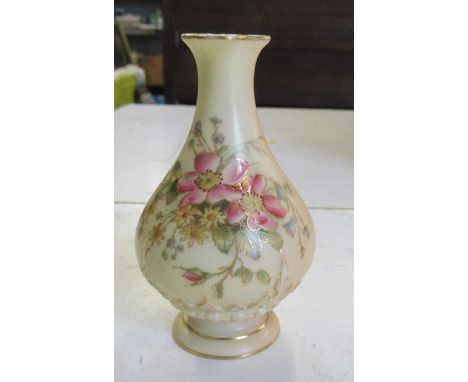 A Royal Worcester vase, decorated with flowers, shape number H285B, height 4.25ins