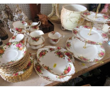 A Royal Albert Old Country Rose tea service and three tier cake stand