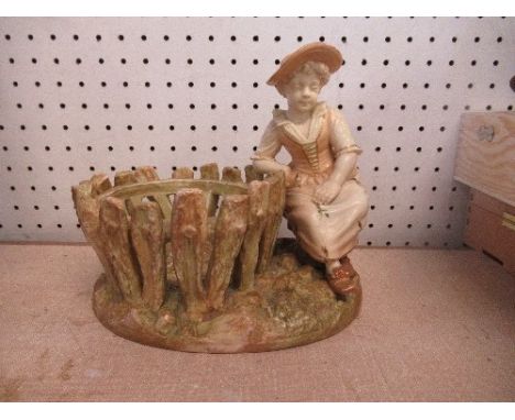 A Royal Worcester shot enamel and gilt figure, a girl seated beside a basket, signed Hadley, 8ins x 7ins
