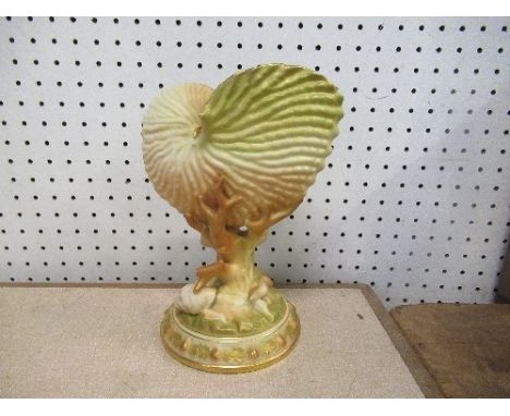 A Royal Worcester blush ivory conch shell, having all over shell decoration, with gilding and shell base, height 9ins