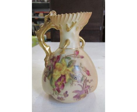 A Royal Worcester blush ivory jug, decorated with flowers, having gilded coral handle, shape number 1507, height 5ins