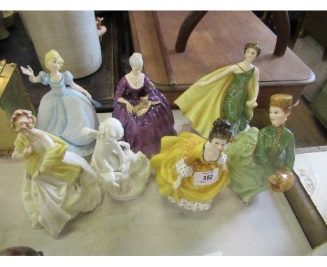 A collection of figures, to include three Royal Doulton, two Worcester and an unmarked Worcester