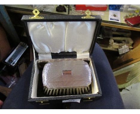 A cased hallmarked silver gentleman's brush and comb