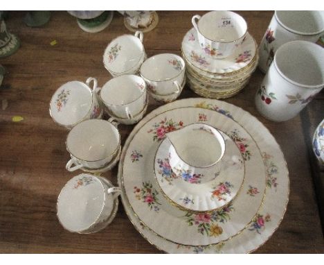 A Royal Worcester Roanoke part tea set, comprising 12 cups, 12 saucers, a jug, a sugar bowl, 2 large plates and 7 side plates