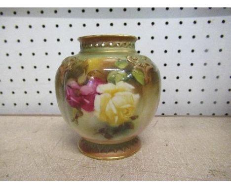 A Royal Worcester circular squat vase, having pierced neck, painted with roses, shape number H278, height 5.5ins