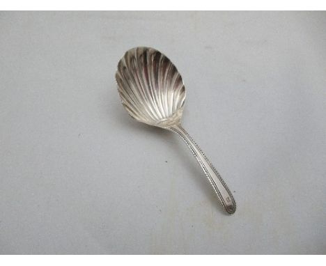 A late Georgian silver shell bowl caddy spoon, maker's mark TW, London 1800