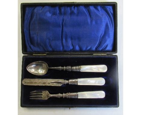 A cased silver christening set, the knife, fork and spoon with mother of pearl handles and engraved decoration