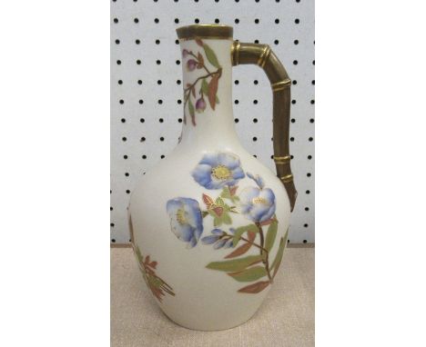 A Royal Worcester blush ivory jug, decorated with flowers, with bamboo handle, height 8ins