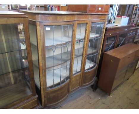 An Edwardian Art Nouveau style double break front display cabinet, with leaded light panels, width 48ins