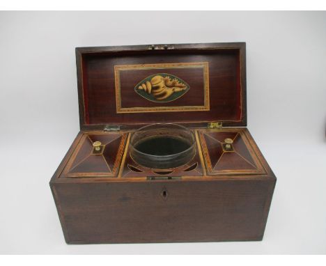 A Georgian inlaid tea caddy with two lidded compartments and glass mixing bowl