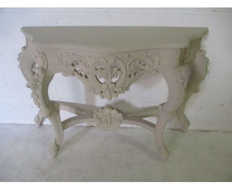 An ornate painted console table