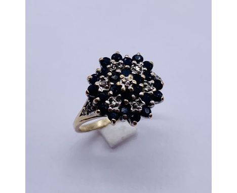 A diamond and sapphire cluster ring set in 9ct gold