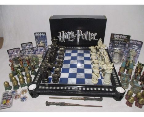 A boxed DeAgostini Harry Potter Chess set including two character sets, chess board, wands, boxed spare pieces, collectors ma