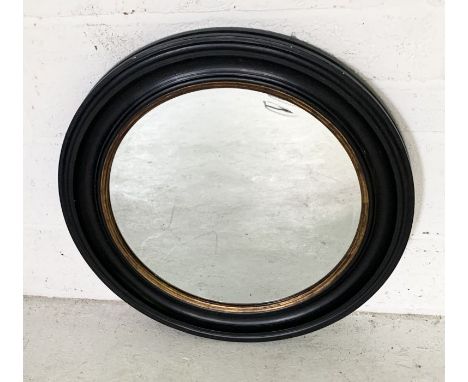 A round wooden framed mirror 67cm Diameter 