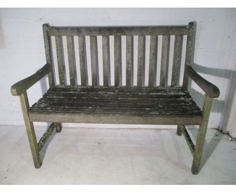 A weathered garden bench. 108cm x 56cm, height 90cm.
