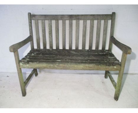 A weathered garden bench. 108cm x 56cm, height 90cm.