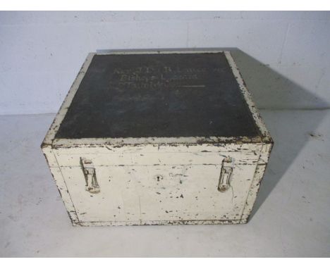 A white painted wooden trunk with metal bounding and handles. Name marked on top (Rev. John Du Boulay Lance, Bishops Lydeard,