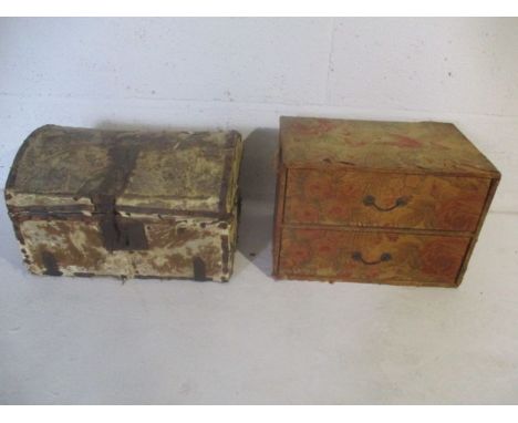 A small pony skin dome topped trunk along with a set of two fabric covered drawers