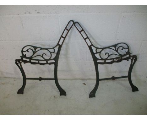 A pair of cast iron bench ends.