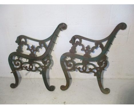 A pair of cast iron bench ends.
