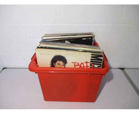 A collection of 12" vinyl records including John Lennon, Phil Collins, Elton John, Beach Boys, Michael Jackson, Paul Simon, B