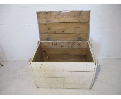 A white painted storage trunk, stamped marked on inside with Lalonde Bros. &amp; Parham