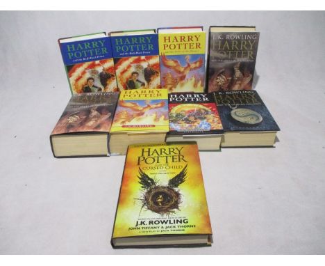 A collection of Harry Potter books including two copies of Harry Potter and the Half-Blood Prince (both 1st editions), four c