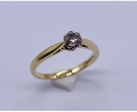 A diamond solitaire ring set in 18ct gold