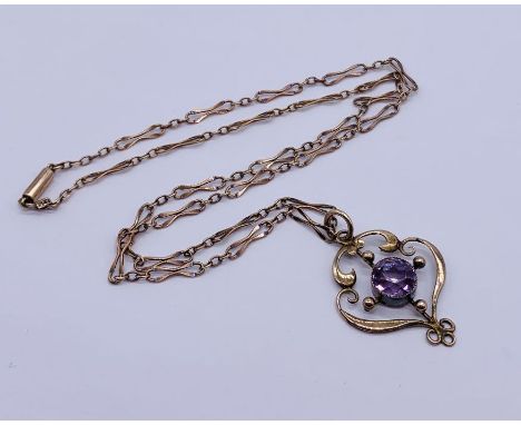 A 9ct rose gold Art Nouveau pendant set with an amethyst on matching chain