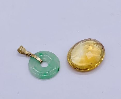 An apple jade pendant set in 14ct gold along with a loose citrine ( measuring 22mm x 1.7mm approx).