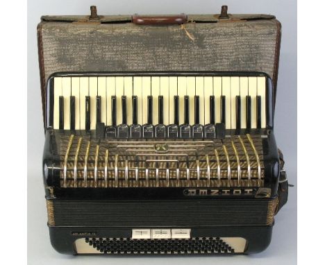 A Hohner Atlantic III piano accordion, in ivory coloured, black and gilt case with twenty-four keys and one-hundred and twent