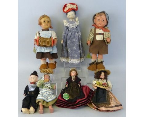 A pair of Goebel Hummel dolls of a boy and girl entitled "Hansl" and "Puppen Mutterchen", 29cm high, a Grodnertal style woode