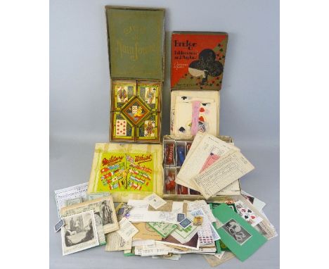 Two boxed games, Military Whist and Jeu De Nain Jaune, boxed Bridge Table Covers and Napkins and a quantity of playing card r