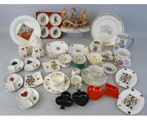 A quantity of playing card related ceramics, including a continental group of three boys seated around a table, various cups 