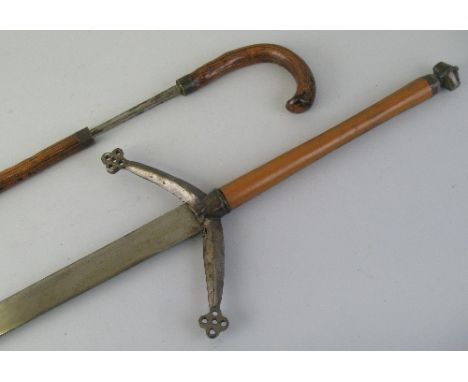A sword stick, the 74.5cm steel tapering square blade with indistinct Birmingham makers mark, curving handle and brass ferrul