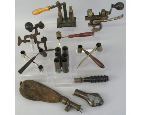 A leather shot flask with brass dispensing measure, 23.5cm long, a copper powder flask, 10.5cm long and a quantity of cartrid