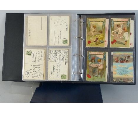 A modern loose leaf album containing approximately two hundred Edwardian and later postcards, real photographic and printed r