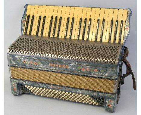 A Hohner Tango III piano accordion, with floral printed blue pearline case, 24 keys and 120 buttons, 51cm wide