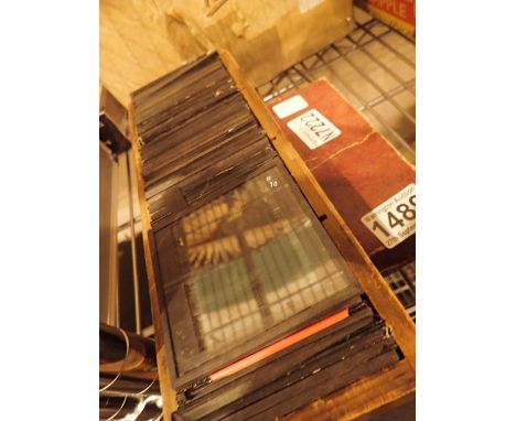 Box of glass photography slides and negatives c1900 of female subjects and members of parliament, approximately 88 slides in 