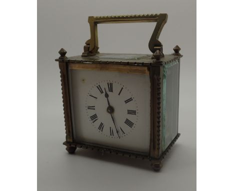 Early 20thC brass carriage clock with bevelled edge glass panels and key, A/F