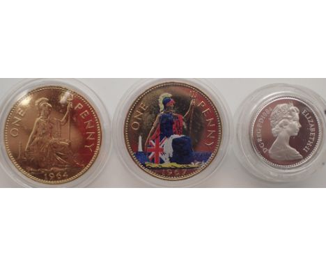 Silver proof 1984 £1 coin and two gold plated pennies, one with enamel