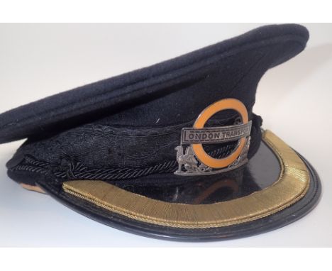 London Transport vintage peaked cap with a hallmarked silver and enamel badge