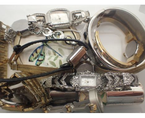 Box of mixed wristwatches and a compact